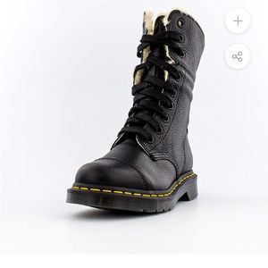 Lace up leather boots with faux fur